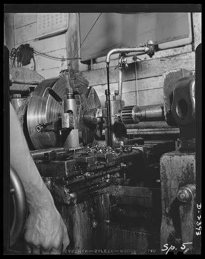 Conversion. Merry-go-round plant. This is a South Bend swing lathe used formerly in the manufacture of merry-go-rounds. This machine, along with others in this New York state plant is now turning out bits and pieces for our war program. Spillman Engineering Company, North Tonawanda, New York
