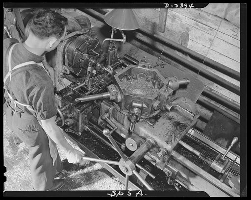 Conversion. Merry-go-round plant. This is a South Bend swing lathe used formerly in the manufacture of merry-go-rounds. This machine, along with others in this New York state plant is now turning out bits and pieces for our war program. The worker is machinist Fred Luther, whose skill was formerly u