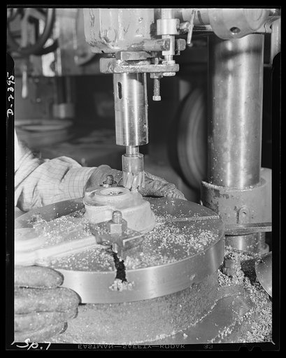 Conversion. Merry-go-round plant. These hands and this machine used to turn out merry-go-rounds to gladden the hearts of the nation's children. The carrousel plant in which they work is now engaged in producing war parts on subcontracts from army and navy contractors. This drill press, operated by m