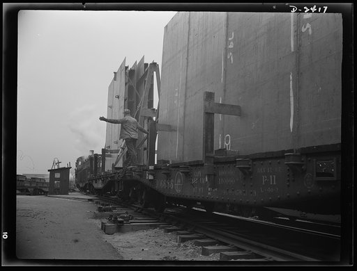 Shipbuilding. "Liberty" ships. These flatcars loaded with prefabricated and assembled sections for ships under construction at a large Eastern yard are leaving a nearby plant formerly used for the manufacture of Pullman cars. The work of this plant means many valuable months saved in the building of