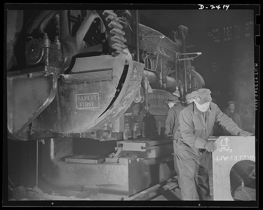 Shipbuilding. "Liberty" ships. Workers at a prefabricating plant turn out steel parts for a large Eastern shipyard building units of Uncle Sam's "Liberty Fleet." Here they operate a giant shear. This plant was originally used to produce freight cars, and the shears are part of the plant's original e