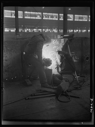 Shipbuilding. "Liberty" ships. Welding is more important than ever before in shipbuilding, saving time, weight and steel. This work is done at a nearby plant which formerly turned out freight cars. All parts are prefabricated in this huge Eastern plant which formerly turned out freight cars. The com