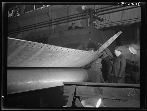 Shipbuilding. "Liberty" ships. This giant plate roller, of German design, is used to roll cold steel shell plates for members of Uncle Sam's new "Liberty Fleet" under construction at a large Eastern shipyard. This prefabrication work is being done at a nearby plant which formerly turned out freight 