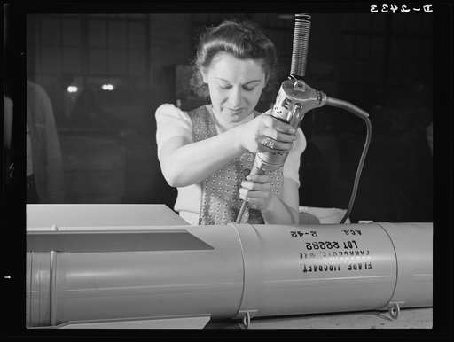 Conversion. Toy factory. From toy trains to parachute flare casings is the work history of Stephanie Cewe, whose skill with this electric screwdriver has been turned to the aid of Uncle Sam's war machine. Then Stephanie used to assemble toy locomotives; today, she uses the same screwdriver to assemb