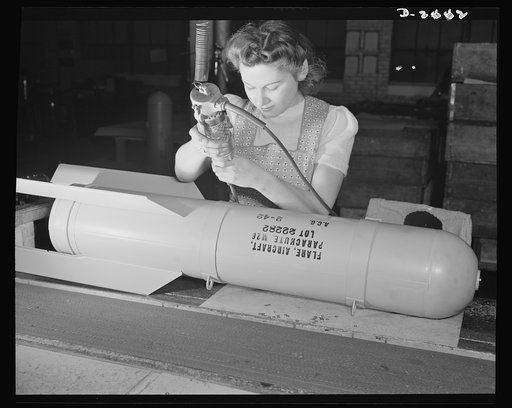 Conversion. Toy factory. From toy trains to parachute flare casings is the work history of Stephanie Cewe, whose skill with this electric screwdriver has been turned to the aid of Uncle Sam's war machine. Then Stephanie used to assemble toy locomotives, today, she uses the same screwdriver to assemb