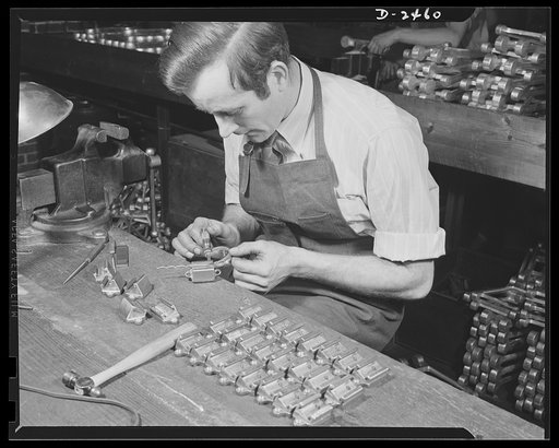 Conversion. Floor waxer plant. He used to be a weaver and repair man for looms, but he's one of Uncle Sam's defense workers now. Employed by a small Eastern floor waxer manufacturing firm, this worker now spends ninty-nine percent of his time working on small parts for gun mounts. Floorola Products 