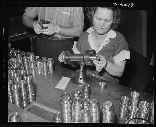 To save time in checking threads on a twenty-millimeter shell booster, a plant superintendant built this machine. It makes possible a speedy checking of thread accuracy in contract to the old hand method. The inventor made the machine out of fan base and a couple pieces of machine steel in a matter 