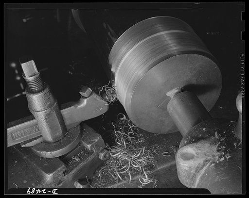 Conversion. Food machinery plant. It was a matter of only a couple of hours to change this block adapter from its former work on the production of cube steak machinery to spout cutting for war subcontracts. Cube Steak Machine Company, Boston, Massachusetts