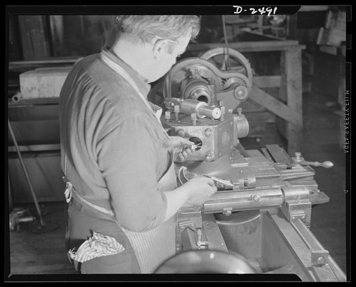 Conversion. Food machinery plant. This turret lathe was purchased second-hand from a nearby shoe factory to speed production on war subcontracts held by a New England plant which formerly turned out cube steak machinery. Edwin Becker is checking on a retooling job in progress which eventually fit th
