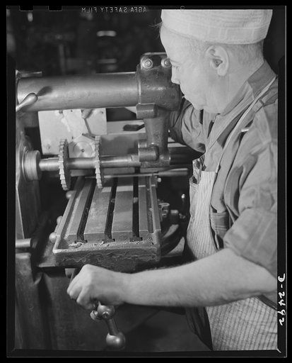 Conversion. Food machinery plant. John J. Morris used to cut steel disc covers with this universal milling machine. These disc covers were part of the cube steak machines which are the normal products of the New England plant where he is employed. Today, however, Morris used the same machine retoole