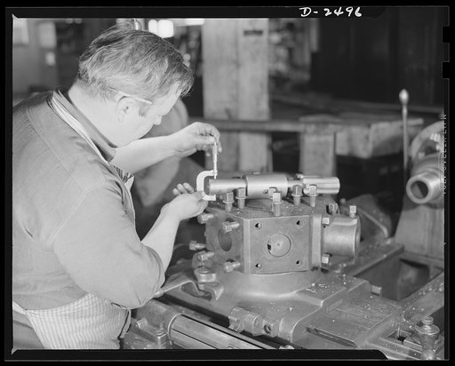 Conversion. Food machinery plant. This turret lathe was purchased second-hand from a nearby shoe factory to speed production on war subcontracts held by a New England plant which formerly turned out cube steak machinery. Edwin Becker is checking on a retooling job in progress which will eventually f