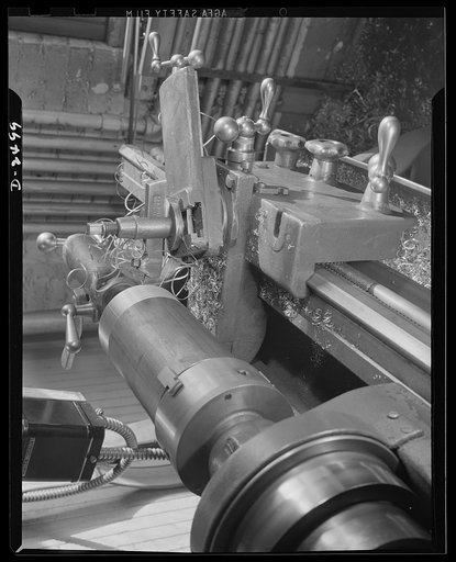 Conversion. Food machinery plant. It was a matter of only a couple of hours to change this block adapter from its former work, on the production of cube steak machinery, to spout cutting for war subcontracts. Cube Steak Machinery Company, Boston, Massachusetts