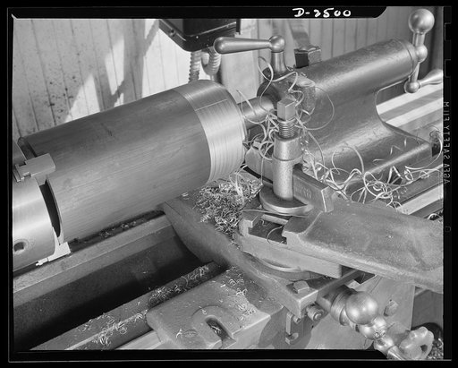 Conversion. Food machinery plant. It was a matter of only a couple of hours to change this block adapter from its former work, on the production of cube steak machinery to spout cutting for war subcontracts. Cube Steak Machinery Company, Boston, Massachusetts