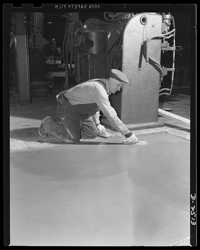 Conversion. Automobile industry. The heavy machinery necessary for the manufacture of medium tank parts often requires new and reinforced floors in assembly plants. In this plant the floor is undergoing conversion, the floor is being reset and strengthened for such machinery. The Plymouth Company, C