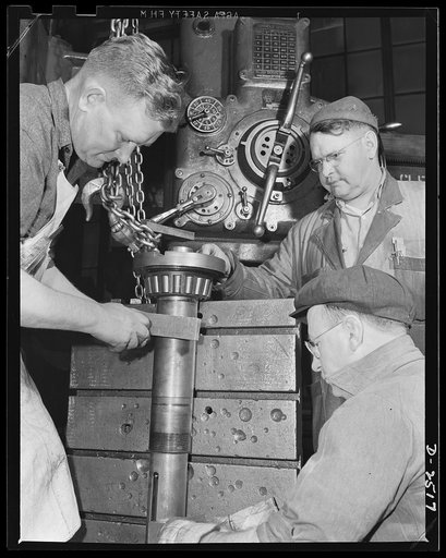 Conversion. Automobile industry. Much larger and heavier than passenger car parts, medium tank parts demands many changes in production machinery before the tank sections can be accomodated. The Plymouth Company, Chrysler Corporation, Detroit, Michigan
