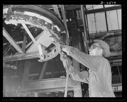 Conversion. Automobile industry. To prepare an automobile assembly plant for war work, all overhead conveyors such as the one pictured above must be removed. The Plymouth Company, Chrysler Corporation, Detroit, Michigan