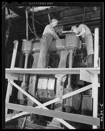 Conversion. Automobile industry. Scaffolding is built around some of the heavy machinery in this automobile plant to aid workers in dismantling it for shipment either for war work or for temporary storage. The Plymouth Company, Chrysler Corporation, Detroit, Michigan