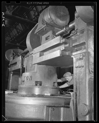 Conversion. Automobile industry. This mammoth machine has just been set in place; a few months ago much lighter equipment made automobile bodies on this spot. The Plymouth Company, Chrysler Corporation, Detroit, Michigan