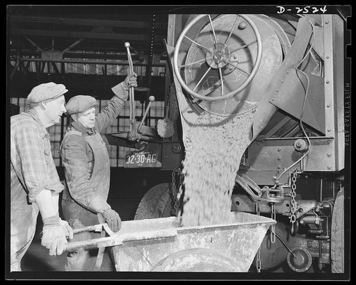 Conversion. Automobile industry. Cement makes new floor foundations for heavy war production machinery in this converted automobile factory. The Plymouth Company, Chrysler Corporation, Detroit, Michigan