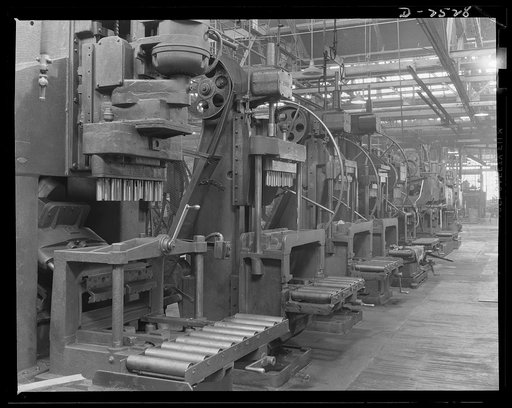 Conversion. Automobile industry. Line of "honing" machines formerly used on automobile motors, have been moved back in the plant to make way for war work. Soon these machines will be stored outdoors until the tools necessary to adapt them to war activities can be completed. The Plymouth Company, Chr