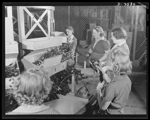 Conversion. Automobile industry. These women employees of an automobile factory are completing a wiring order for the U.S. government, using stock on hand, just prior to the company's conversion to war production. The Plymouth Company, Chrylser Corporation, Detroit, Michigan