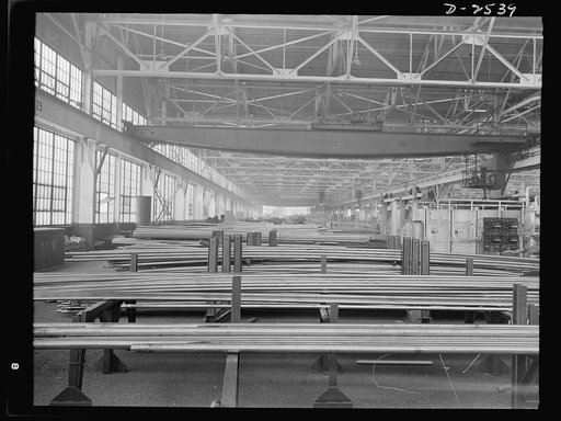 Conversion. Copper and brass processing. The inside of a large brass and copper tube mill. Copper tubes are made in many sizes, and in many alloys, and are needed for war production in hundreds of different ways--from small diameter tubing for gas and oil lines in airplanes and tanks and motor cars 