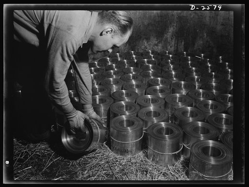 Conversion. Copper and brass processing. Coils of brass and copper metal are loaded into a freight car and shipped to factories where it is fabricated into thousands of metal parts needed for our war program, or to our airplane submarine, or ship-building industries to become parts of their producti