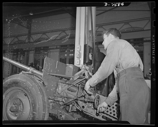 Conversion. Safe and lock company. Assembling weapons for Victory to be used by the armed forces. Gerald Smith, twenty-eight, assembles thirty-seven-millimeter gun mounts in a factory which formerly made safes and locks. York Safe and Lock Company, York, Pennsylvania