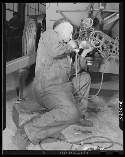 Conversion. Safe and lock company. Sixteen years as an auto mechanic, this worker now assembles thirty-seven-millimeter gun mounts in a factory which formerly made safes and locks for civilian use. York Safe and Lock Company, York, Pennsylvania