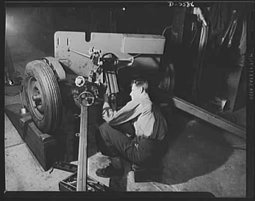 Conversion. Safe and lock company. Assembling weapons for Victory to be used by the armed forces. Gerald Smith, twenty-eight, assembles thirty-seven-millimeter gun mounts in a factory which formerly made safes and locks. York Safe and Lock Company, York, Pennsylvania