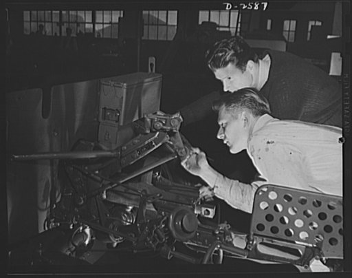 Conversion. Safe and lock company. Painting thirty-seven-millimeter gun mounts now produced in a factory which formerly made safes and locks for civilian use. York Safe and Lock Company, York, Pennsylvania