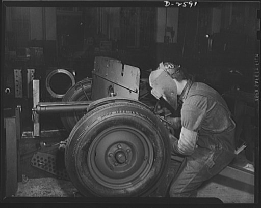 Conversion. Safe and lock company. Not for your car, but for a much more vital machine: this tire is destined for use on a thirty-seven-millimeter gun mount, now being assembled in a factory which once produced locks and safes for civilian use. York Safe and Lock Company, York, Pennsylvania