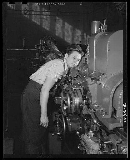 Conversion. Safe and lock company. Listening for defects during the grinding of a powder chamber for a thirty-seven-millimeter gun for Uncle Sam's armed forces. Site of this production is a former lock and safe company now converted to manufacture of weapons for victory. York Safe and Lock Company, 