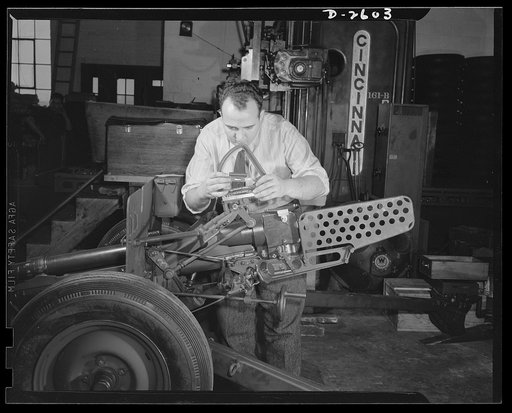 Conversion. Safe and lock company. Checking and inspection of thirty-seven-millimeter gun mounts for America's armed forces in a factory once devoted to manufacture of safes and locks for civilian use. York Safe and Lock Company, York, Pennsylvania