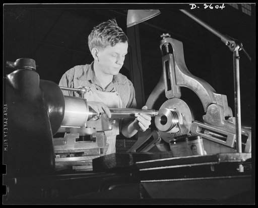 Conversion. Safe and lock company. Basing off the breech end of a thirty-seven-millimeter gun, this young worker is one of the millions of Americans hard at work behind the men behind the guns. Site of these operations is a factory which formerly made locks and safes, before its conversion to produc