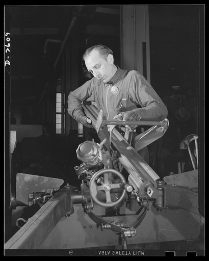 Conversion. Safe and lock company. Assembling the weapons of democracy. In a factory which formerly manufactured safes and locks, today thirty-seven-millimeter guns and gun mounts are coming off the assembly line. York Safe and Lock Company, York, Pennsylvania