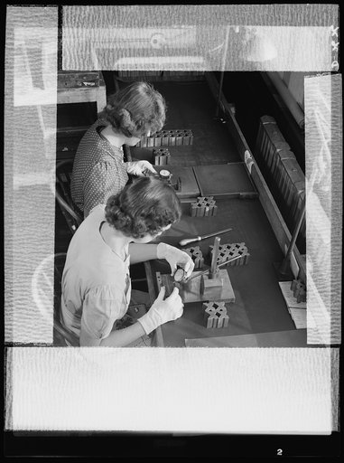 Conversion. Safety razor plant. Final inspection of V-blocks made by converted machines of a New England safety razor company. Gillette