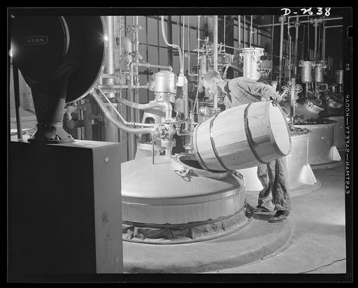 Synthetic rubber (Ameripol). Carefully selected soap is used in the making of solutions used during the manufacture of synthetic rubber. This worker is mixing a solution at the B.F. Goodrich plant, in Akron, Ohio. It is mixed in a nickel-lined tank. Goodrich