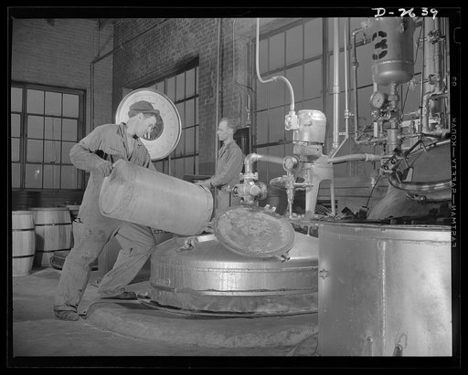 Synthetic rubber (Ameripol). Carefully selected soap is used in the making of solutions used during the manufacture of synthetic rubber. This worker is mixing a solution at the B.F. Goodrich plant, in Akron, Ohio. It is mixed in a nickel-lined tank. Goodrich