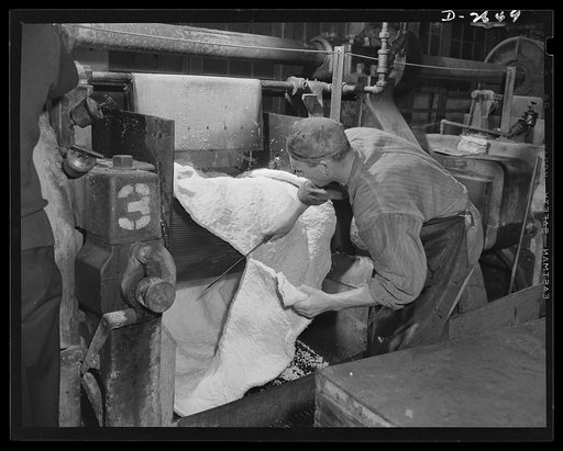 Synthetic rubber (Ameripol). This sheet of synthetic rubber coming off the rolling mill at the Akron, Ohio plant of the B.F. Goodrich Company is now ready for drying