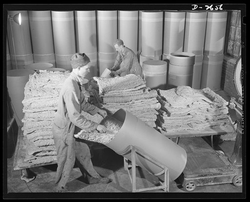Synthetic rubber (Ameripol). Now thoroughly dried, these sheets of synthetic rubber are packed in larger paper drums, each holding 200 pounds for shipment. Goodrich