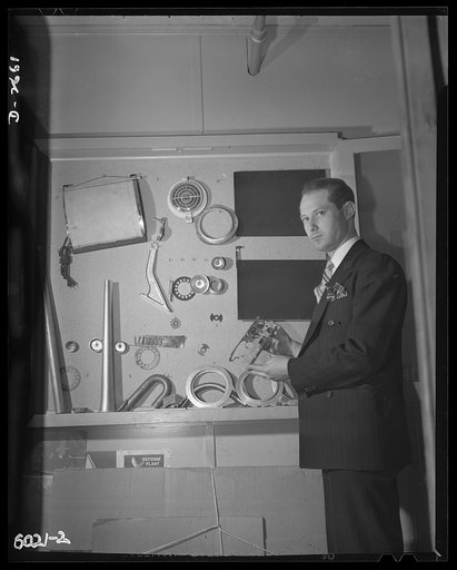 Conversion. Frying pans to aircraft parts. Peacetime production of this small Eastern manufacturing plant consisted of such objects as the aluminum photograph dryer (upper left), radio dials, and similar articles for civilian use. Its parts for America's fighting planes. Pictures above is one of the
