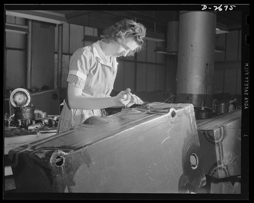 Self-sealing fuel tanks. Not only as nurses behind the battle lines, but as workers in the factory producing important war goods, women are doing much to win this war and to spare the lives of the men doing the actual fighting. These girls are stitching inner ply to a building form used in the manuf
