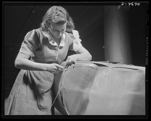 Self-sealing fuel tanks. Not only as nurses behind the battle lines, but as workers in the factories producing important war goods, women are doing much to win this war and to spare the lives of the men doing the actual fighting. This girl is applying the cover of self-sealing fuel tank. Goodrich