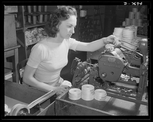 Fiberglass manufacture, Owens-Corning, Toledo, Ohio. This inspector sees to it that rigid requirements in the manufacture of fiberglass electrical insulation supplied under Army and Navy specifications are fulfilled