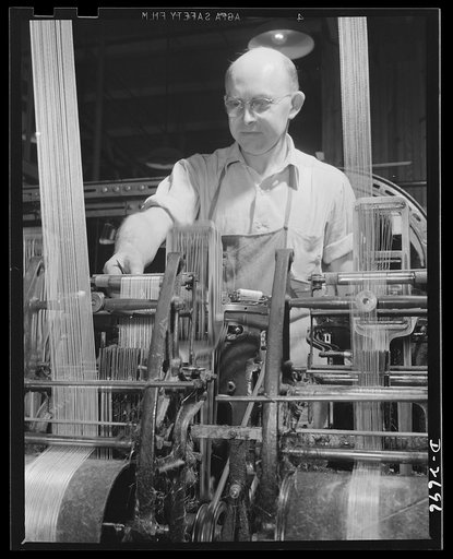 Fiberglass manufacture, Owens-Corning, Toledo, Ohio. One of the workmen in a plant of Owens-Corning Fiberglass Corporation carefully adjusts a loom weaving tape which must meet rigid Army and Navy specifications to insulate electrical equipment