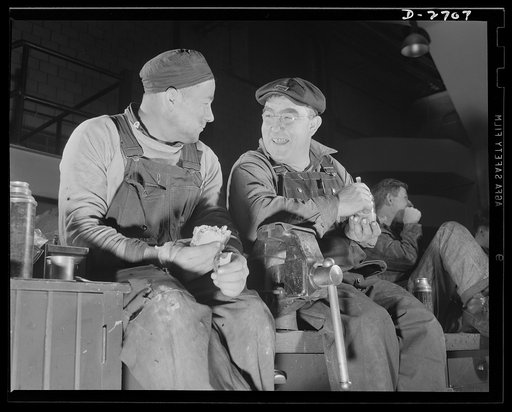 Fiberglass manufacture, Owens-Corning, Toledo, Ohio. Two maintenance men relax for sandwiches and coffee during their lunch hours at a plant of the Owens-Corning Fiberglass Corporation