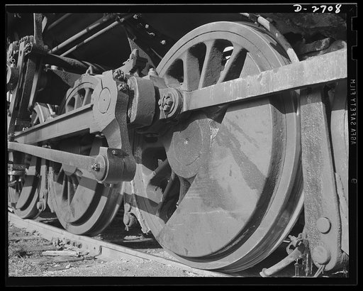 Fiberglass manufacture, Owens-Corning, Toledo, Ohio. The wheels of a switch engine are ready to shunt cars loaded with fiberglass materials onto the main line for movement to vital war industries