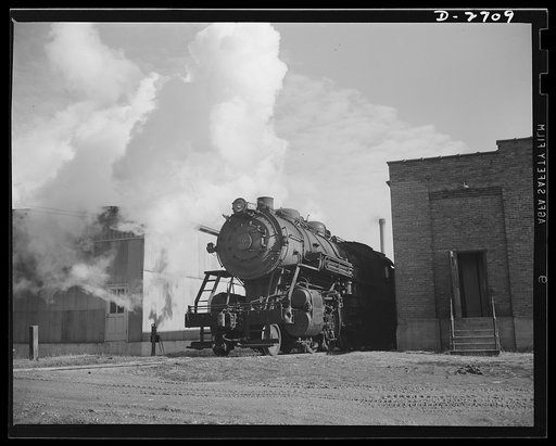 Fiberglass manufacture, Owens-Corning, Toledo, Ohio. Out from a siding moves a trainload of fiberglass materials headed for many destinations. The glass fabric will be used in a Midwestern bomber plant now under construction and in the laboratories of medical supply houses where miles of fiberglass 