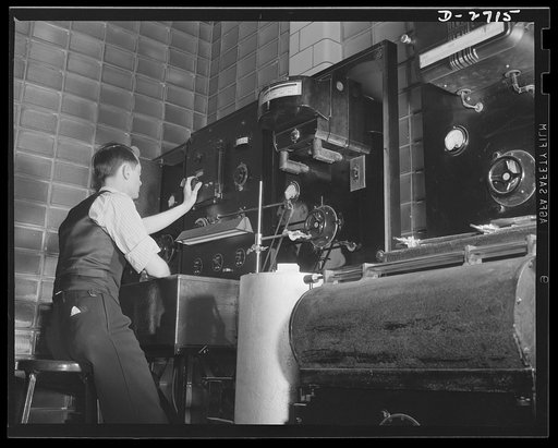 Fiberglass manufacture, Owens-Corning, Toledo, Ohio. To provide accurate performance data, this engineer is one of many in the physical testing laboratories of Owens-Corning Fiberglass Corporation who measures insulating characteristics of fiberglass materials